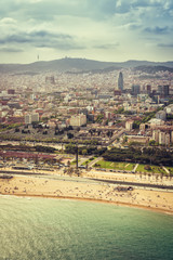 Naklejka premium Barcelona aerial, city skyline and the beach, Spain. Helicopter view. Vintage colors