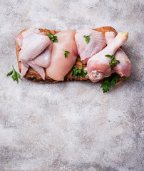 Raw chicken meat fillet, thigh, wings and legs