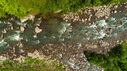 Aerial view of mountain river in summer.