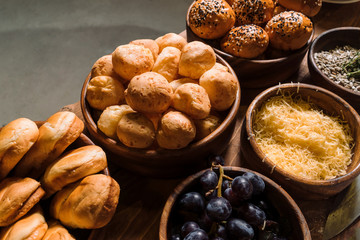 Homemade buns in a beautiful wooden cup. Diagonal composition