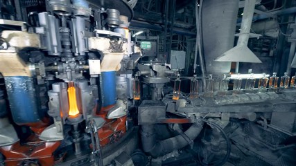 Glass bottles are becoming incandescent, getting shaped and going to get annealed