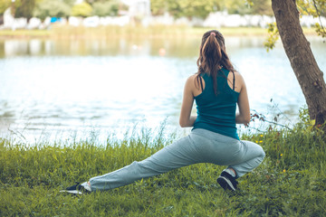 Beautefull girl with fitness exercise for relax and healthy at lake, Nature background, Concept outdoor sport and health