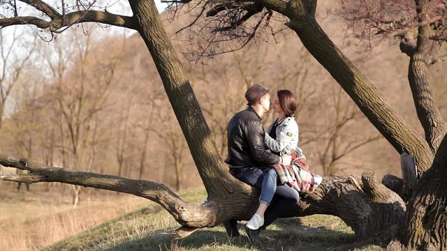 Two lovers spend time together in nature, in a romantic atmosphere