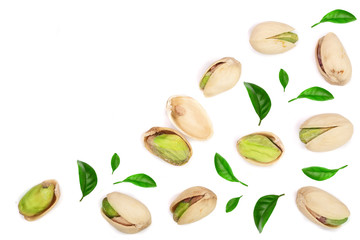 Pistachios with leaves isolated on white background with copy space for your text, top view. Flat lay pattern