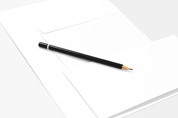 Blank sheets of paper, envelopes, and pencil 
