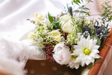 Wedding bouquet different flowers. Modern bridal bunch with poppy flower and thistle.
