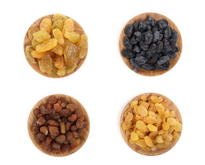 Collection of raisins in wooden bowl isolated on a white background. Top view. Flat lay