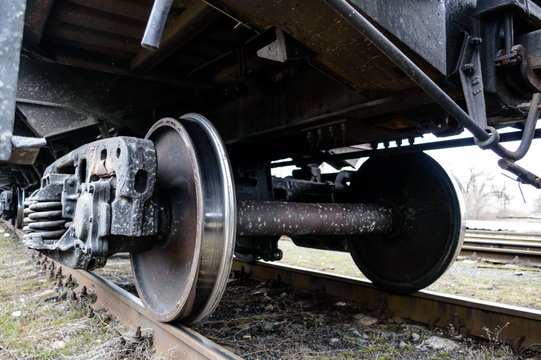 Railway transport: Iron wheels of the freight car on rails.
