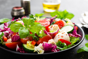 Salad with chicken meat. Fresh vegetable salad with chicken breast. Meat salad with chicken fillet and fresh vegetables on plate