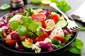 Salad with chicken meat. Fresh vegetable salad with chicken breast. Meat salad with chicken fillet and fresh vegetables on plate