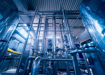 Beverage factory interior. Conveyor with bottles for juice or water. Equipments