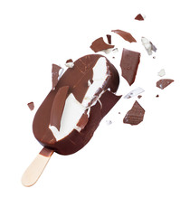 Chocolate ice-cream broken into pieces in the air on a white background