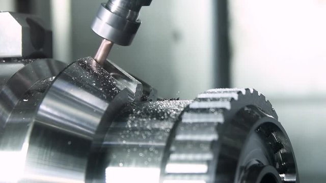 cogwheel or involute gear surface milling process. Industrial CNC metal machining