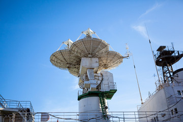 large radar dishes on the deck of the ship