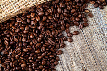 Dark roasted coffee beans with a hessian or jute natural colour sacking