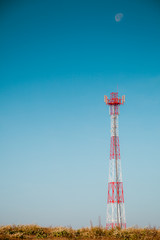 Signal tower against blue sky