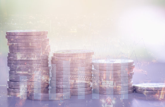 Double exposure row of coins with city background and column graph, Finance and business concept