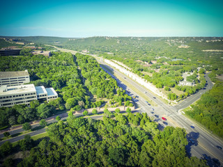 Vintage aerial view green North Capital of Texas Highway and tree lushes landscape of Hill Country....