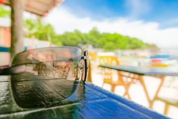 Beautiful colors of tropical holidays, sunglasses looking at exotic island