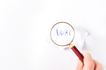 The word "War" under the magnifier on a white background.