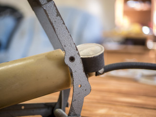 old vintage pedal foot pump close up on the wooden table