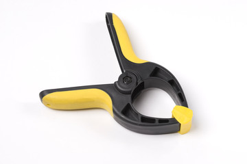 Obraz premium Plastic clamp on white background 