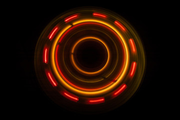 Music concept. Freezelight glowing vinyl on dark background or Turntable playing vinyl with glowing abstract lines concept on dark background.
