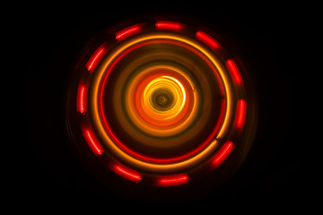 Music concept. Freezelight glowing vinyl on dark background or Turntable playing vinyl with glowing abstract lines concept on dark background.