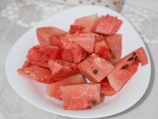sliced watermelon in white plate