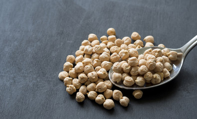 close-up dried chickpeas on a spoon