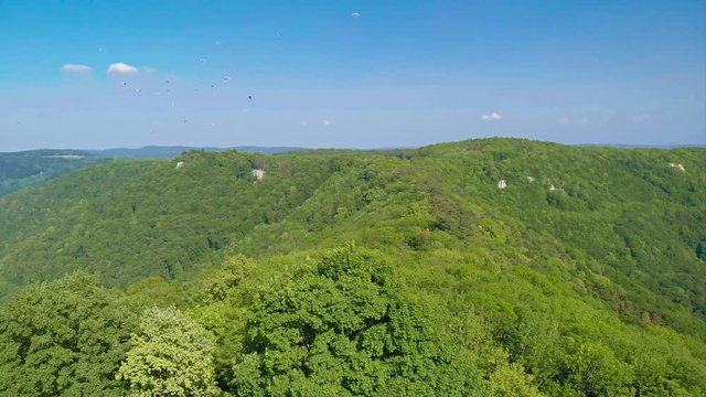 Beautiful landscape of swabian alb and beautiful forest at Beuren - Paragliding around castle Hohenneuffen in Southern Germany with a view on Neuffen, Esslingen, Stuttgart