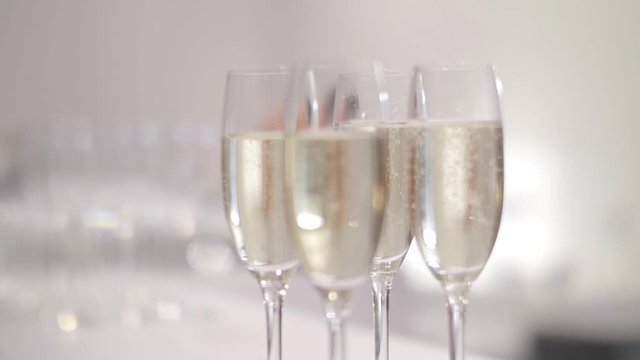 Many beautiful champagne glasses on the table at a paerty or other event. Holidays, celebration concept.