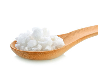 Fototapeta na wymiar salt in wood spoon on white background
