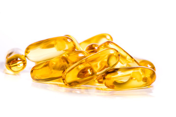 Close up the vitamin D and Omega 3 fish oil capsules supplement  for good brain , heart and health eating benefit