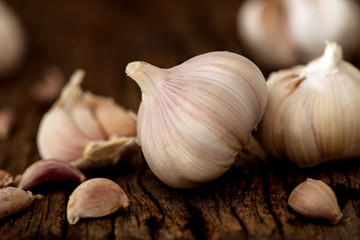 Close up  group of garlic on kitchen wooden table
