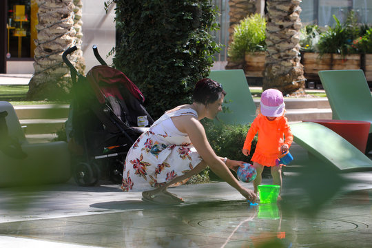 Close Up Portrait Of Beautiful Mother And 2 Years Old Blonde Toddler Girl In Pink Summer Hat, Mother Playing With Baby Girl, Happy Family Concept, Having Fun In Scottsdale Arizona USA