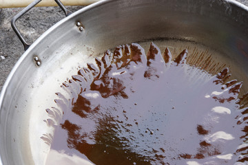 Waste frying oil on the bottom of pan