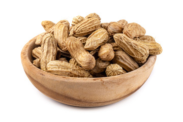 Dried peanuts in wooden bowl isolated on a white background