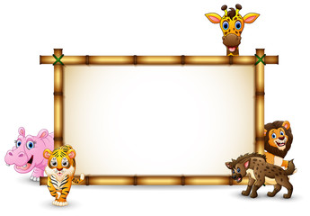 The animals playing together with bamboo frame