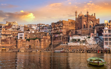 Historic Varanasi city with old architectural buildings and temples at sunset. Photograph taken...