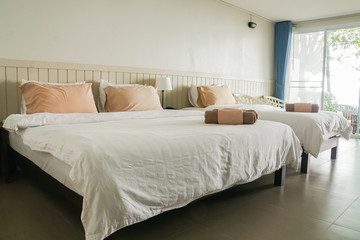 master bedroom in hotel with two double beds for family trip
