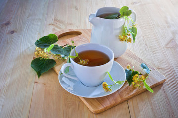 Linden tea on wooden table