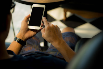 Close up of a man using mobile smart phone.