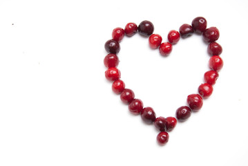 Cherries. Cherry Heart. Cherries in color bowl and kitchen napkin. Red cherry. Fresh cherries. Cherry on white background. healthy food concept