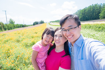 family with landscape in Furano