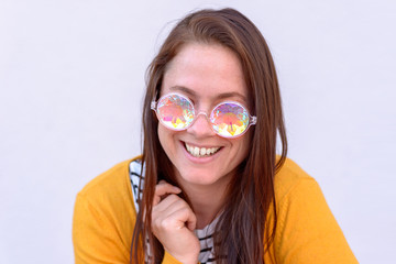 Cheerful young brunette woman with sunglasses