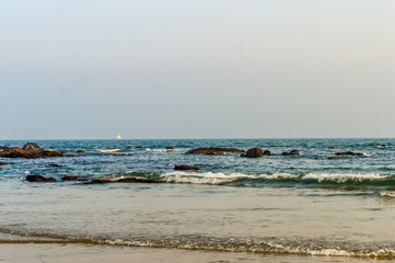 Beautiful sea shore at sunrise or sunset sunset Wild Empty Tropical beach, blue sky, sunlight reflextions on the shore at sunset time on a sunny day in in as landscape style used background travel vat