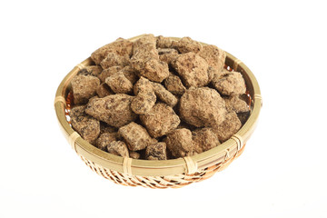  Brown Sugar in a bamboo basket on white background  