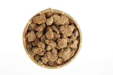  Brown Sugar in a bamboo basket on white background  