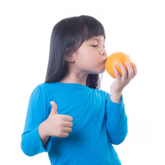 Little girl playing with fresh mandarin fruits